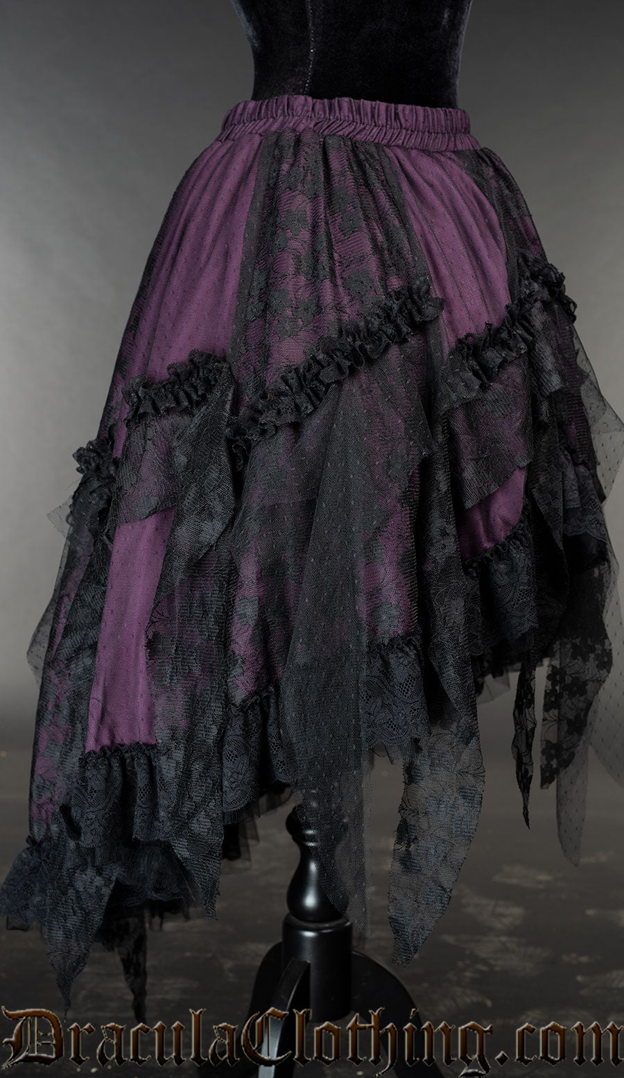 Side view of purple lace and satin skirt showing high low style shorter in the front than the back