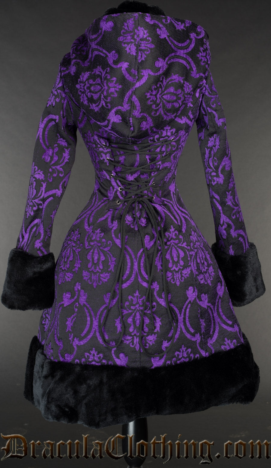 Back view of black and purple brocade winter coat showing adjustable corset style lacing in the torso at the back