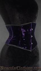 Purple velvet waist cincher corset, side view with front busk closure