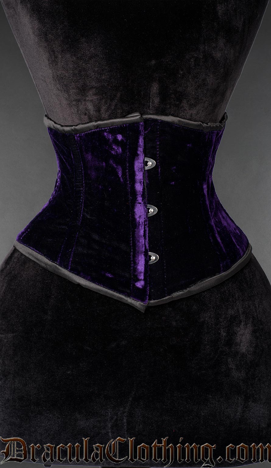 Purple velvet waist cincher corset with front busk closure on a mannequin