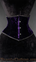 Purple velvet waist cincher corset with front busk closure on a mannequin