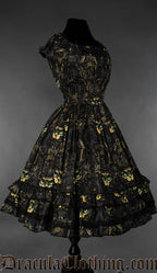 Side view of sphinx cat printed women's dress showing elasticated waist and sleeves