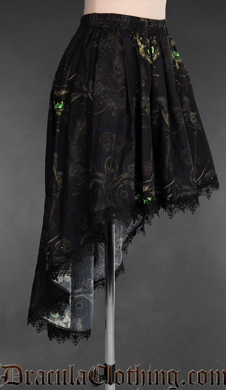 Side view of high low women's skirt made in black cotton with a sphinx cat design and black lace trim