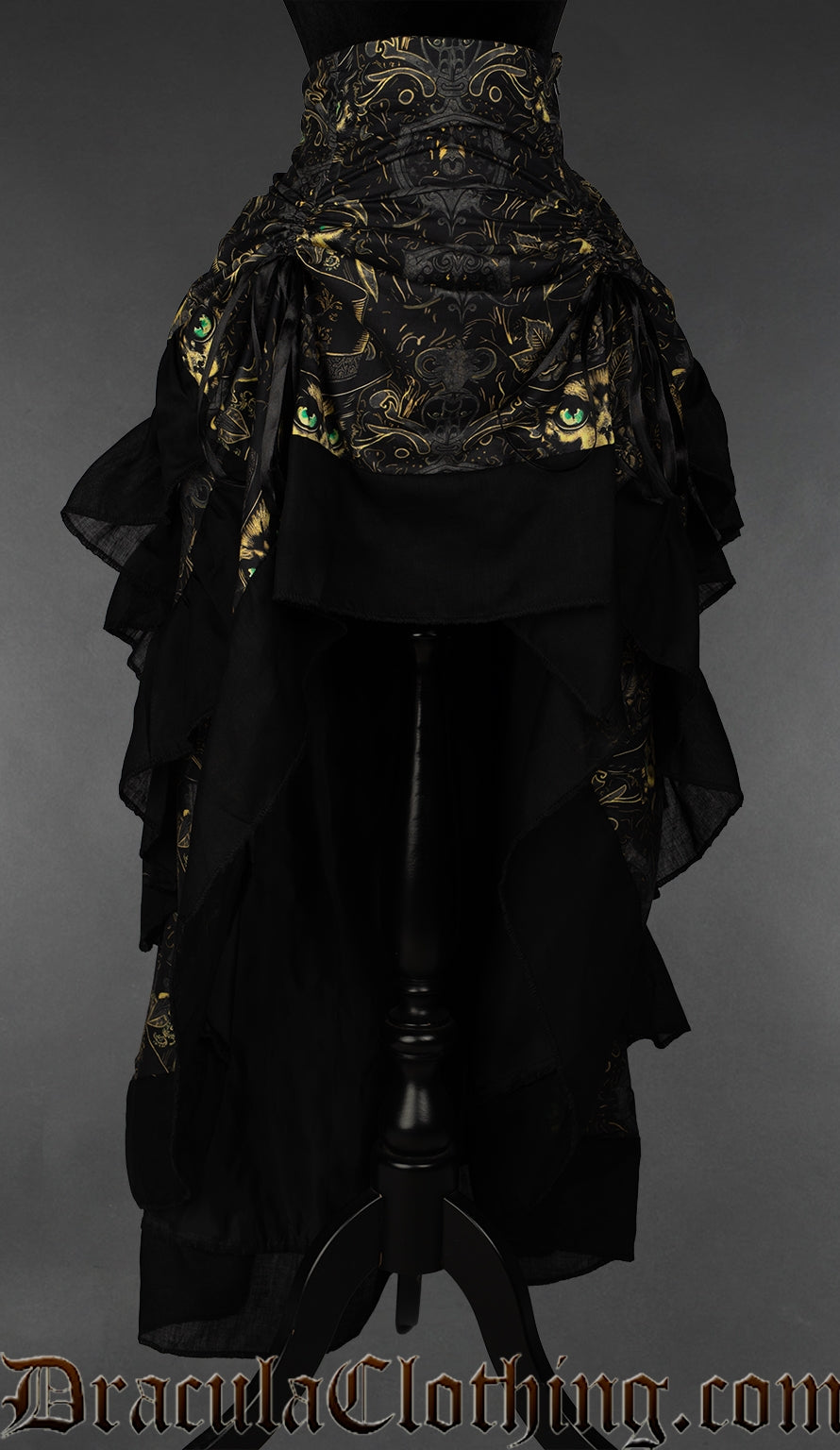 Women's layered bustle skirt with gold grey and black cat print design shown with front layer of skirt pulled up