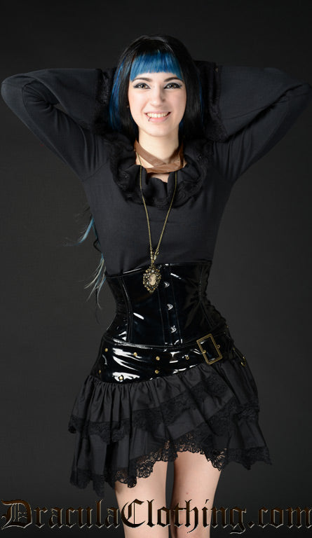 Model wearing black PVC waist cincher with a blouse and skirt