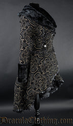 Side view of black and gold thick brocade women's coat showing high low hem longer in the back than the front