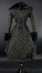 Back view of women's black and gold coat showing adjustable corset style lacing in the torso