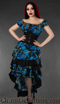 Women's blue and black layered bustle skirt with raven and music themed print worn with a waist cincher and matching print dress