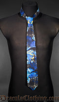 Neck tie in blue black and yellow multicoloured print featuring ravens and sheet music