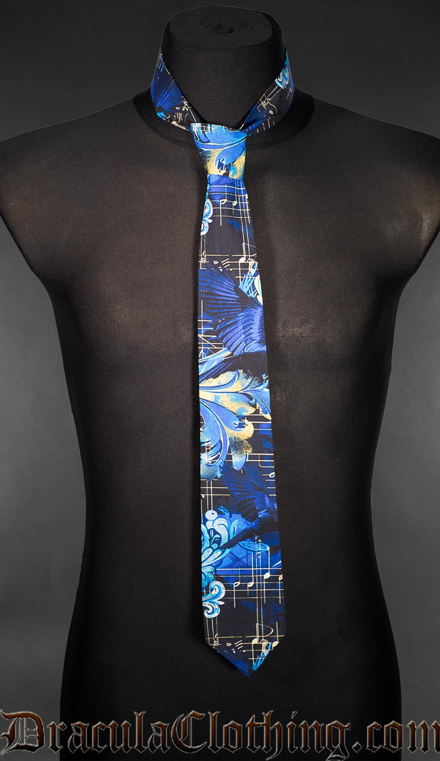 Neck tie in blue black and yellow multicoloured print featuring ravens and sheet music