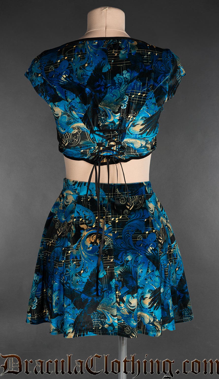 Back view of women's raven print velvet crop top showing adjustable lacing in the back