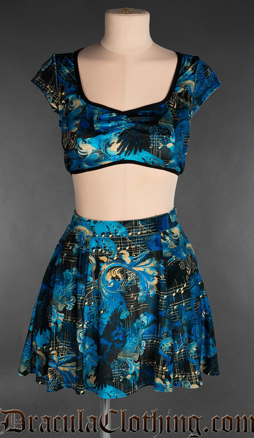 Women's short velvet skirt in multicoloured blue and black raven and music inspired print