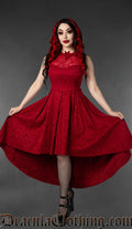 Women's high low dress made with red brocade fabric and a sheer lace illusion chest panel with bat shaped collar