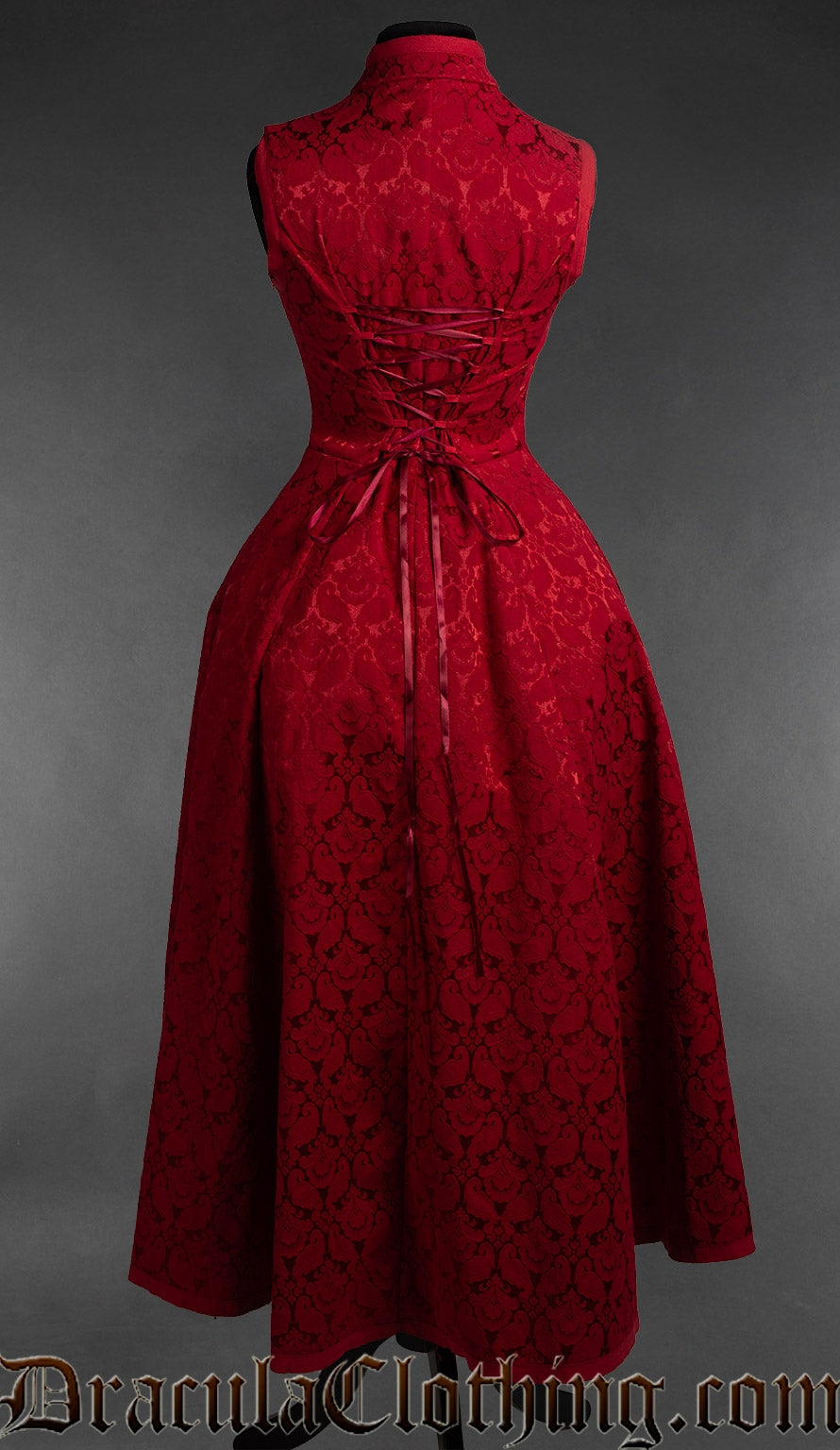 Back view of women's red brocade sleeveless dress showing adjustable corset style lacing in the torso and the long skirt in the back