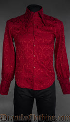 Red brocade gothic shirt with fitted waist, pointed collar, and long sleeves on mannequin