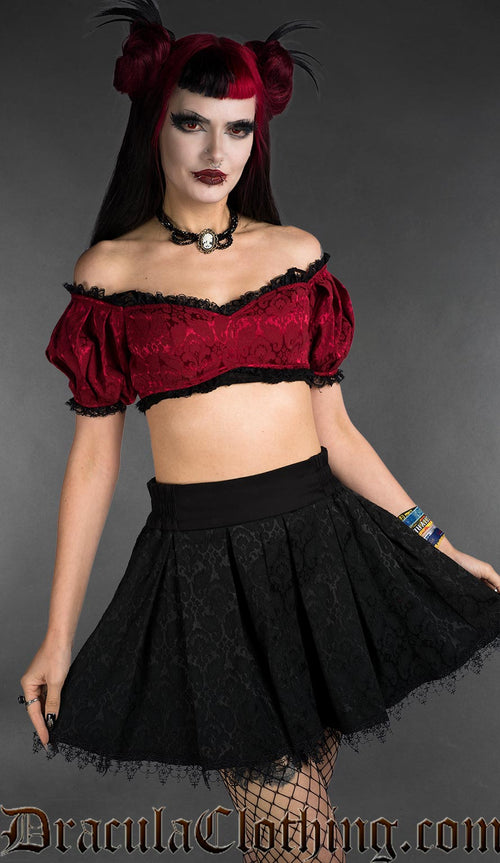 Red brocade gothic crop top with black lace trim, off-shoulder style, front view on model