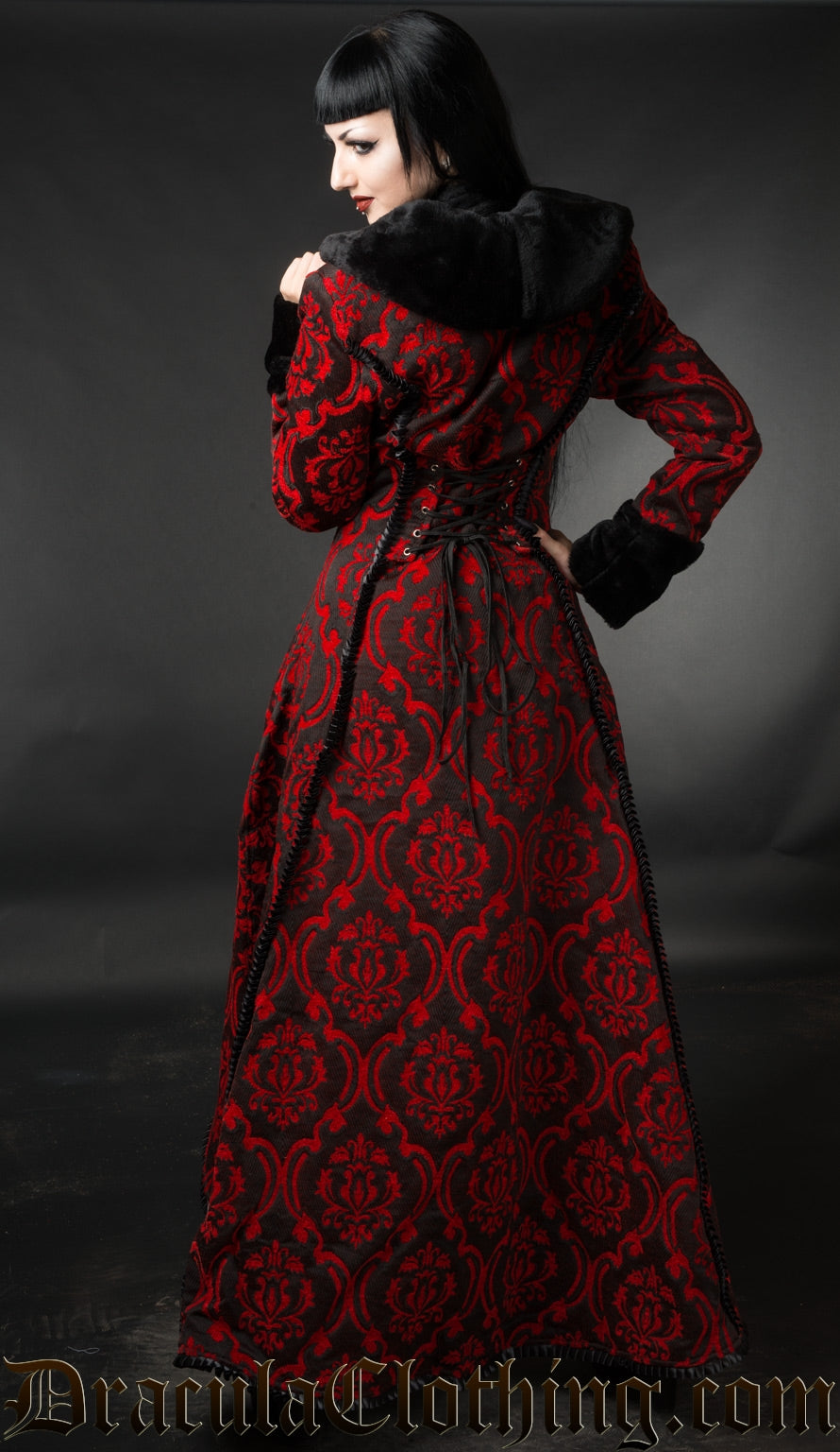 Model showing the back of black and red long women's winter coat showing faux fur collar adjustable back lacing and satin trim details