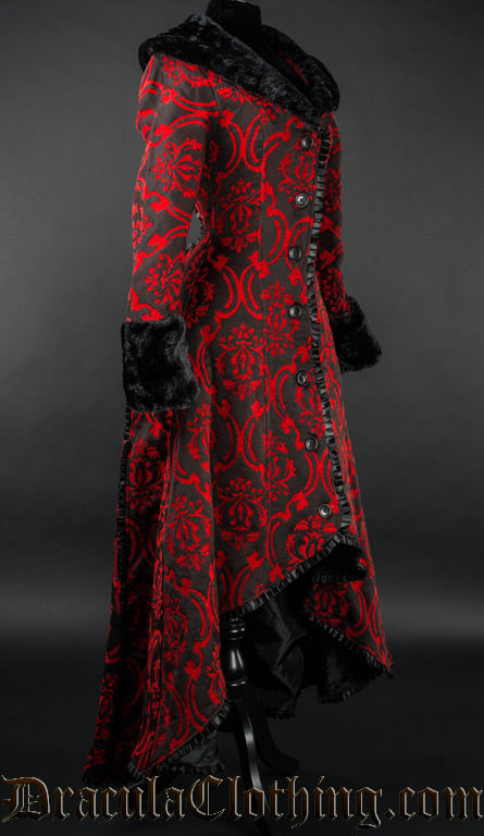 Side view of women's red and black winter coat with black faux fur accents showing high low style of a longer back and shorter front