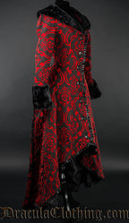 Side view of women's red and black winter coat with black faux fur accents showing high low style of a longer back and shorter front