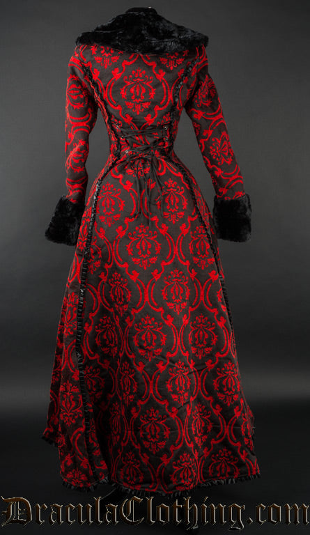 Back view of red and black brocade women's coat showing adjustable corset style lacing and long back of high low style