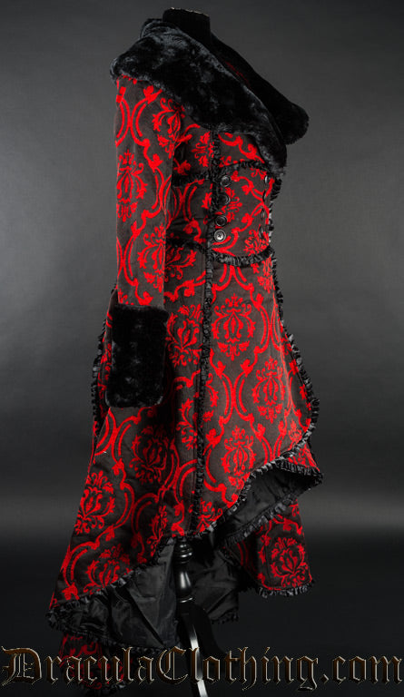 Side view of women's red and black brocade coat showing high low skirt style