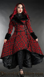 Model wearing women's satin-lined black and red brocade high low coat with black faux fur collar and sleeve cuffs