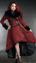 Women's high low coat in a wrap around style made with red and black thick brocade fabric in a damask pattern and faux fur accents
