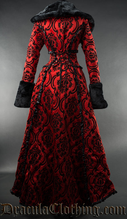 Back view of red and black brocade women's winter coat in a damask pattern with faux fur accents