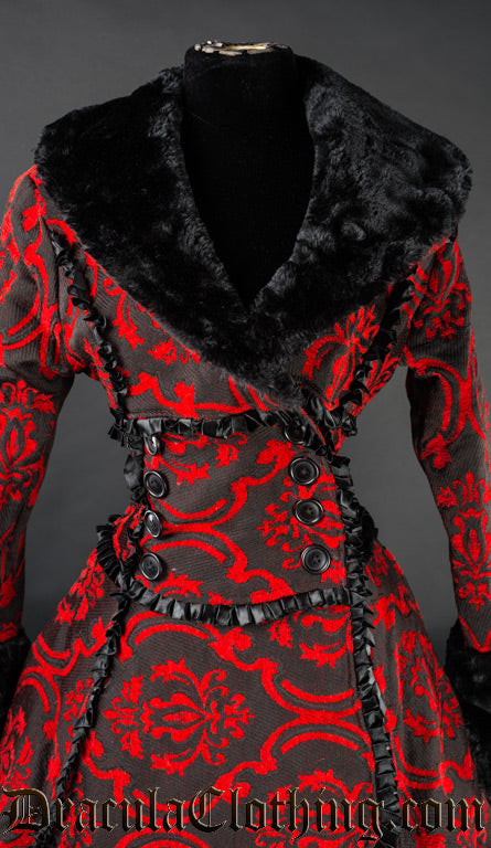Close up front view of red and black women's winter coat showing wrap closure with buttons and faux fur collar