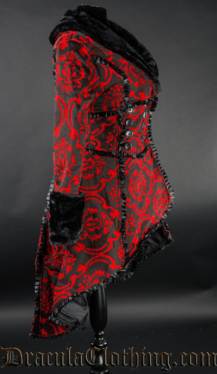 Side view of red and black winter coat showing high low style of longer in the back and shorter in the front