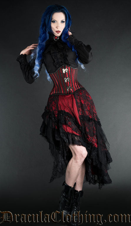 Model wearing red and black ruffle skirt made from satin and lace layers with additional corset and blouse