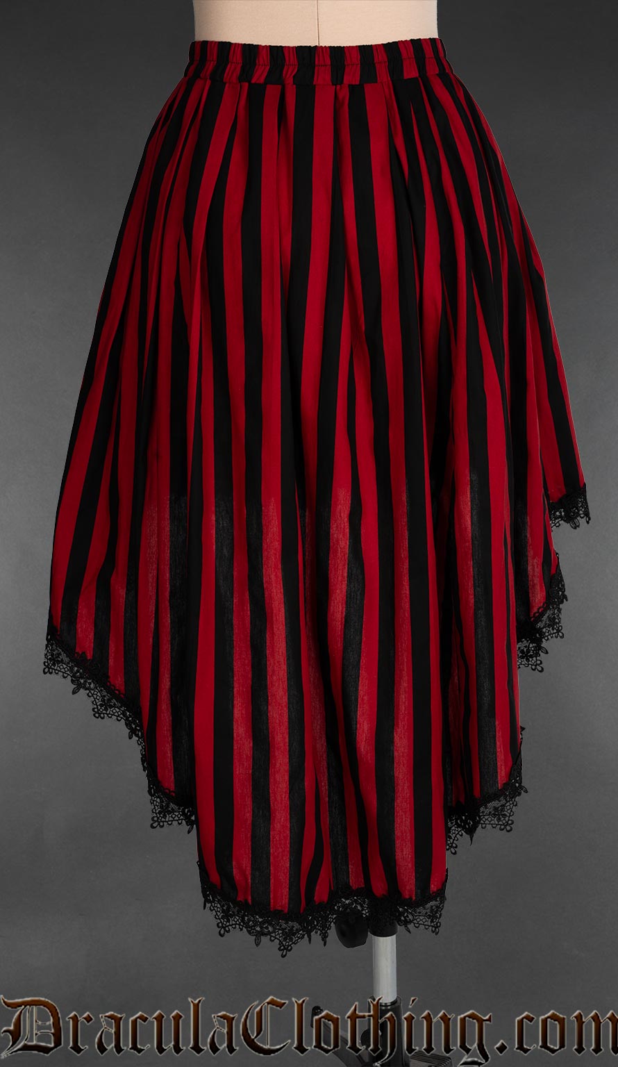 Back view of women's high low skirt made with red and black striped cotton and black lace trim with an elasticated waist
