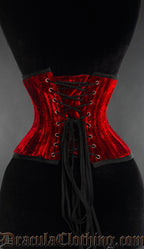 Back view of double boned red velvet waist cincher showing matching modesty panel and adjustable lacing