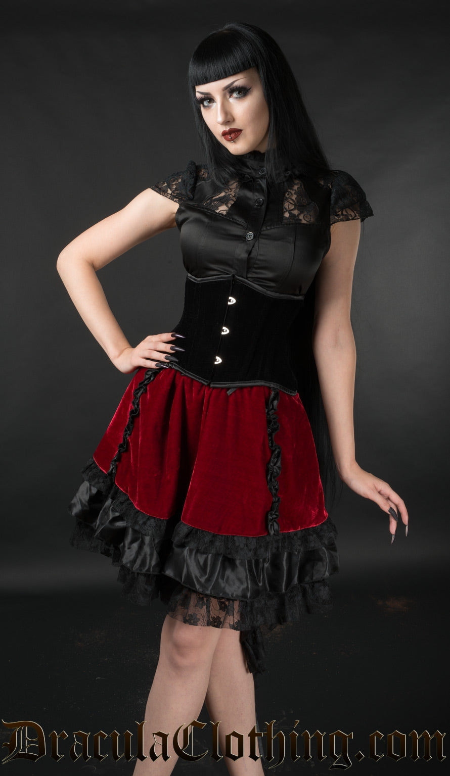 Red velvet and black satin high low EGL skirt worn by model with cincher and blouse