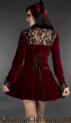 Burgundy red velvet gothic blouse with black lace back panel and corset lacing, rear view on model