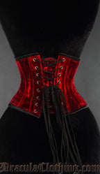 Back view of red velvet waist cincher showing adjustable corset lacing