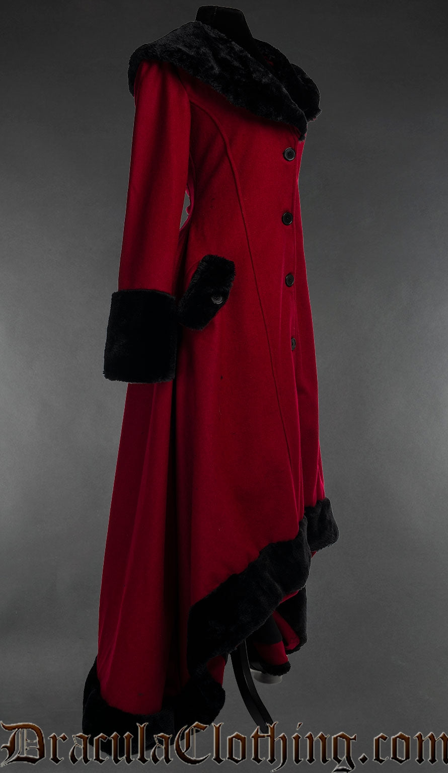Side view of women's red wool coat with black faux fur accents showing high low style that is shorter in the front than the back