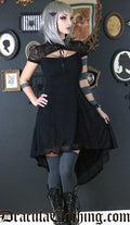 Model wearing lace black high low dress with keyhole neckline
