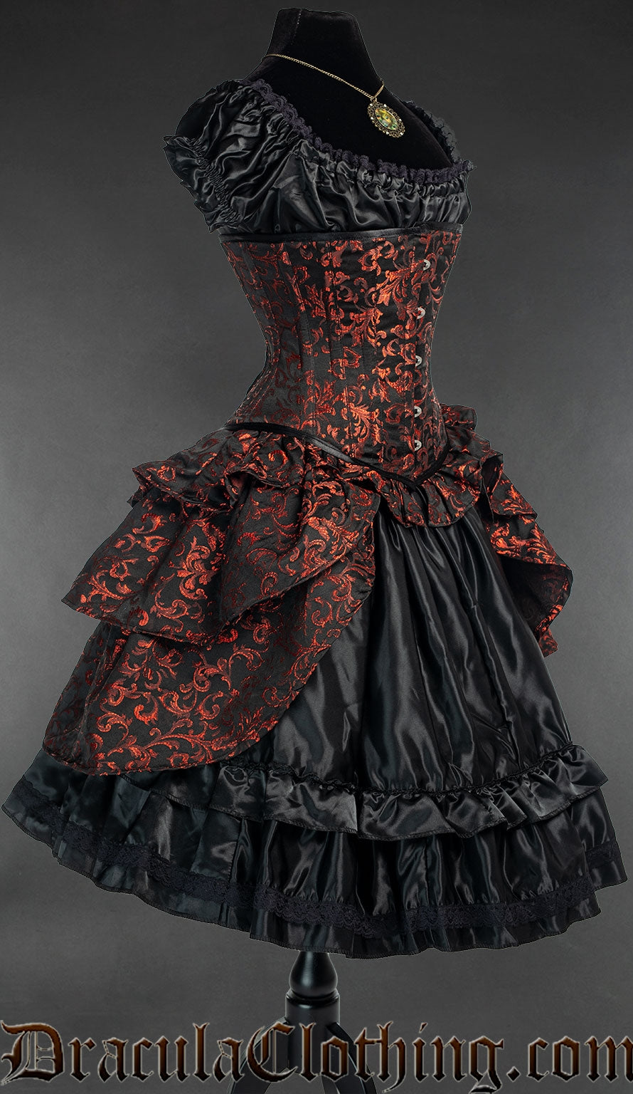 Side view showing the volume of additional bustle skirt style attachment on a red and black brocade corset 