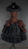 Women's corset with attached bustle skirt feature made from red and black brocade fabric shown over a black satin dress