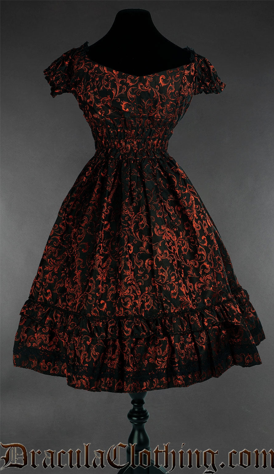 Back view of women's red brocade dress showing stretchy elasticated waist