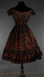 Back view of women's red brocade dress showing stretchy elasticated waist