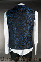Back view of men's sapphire brocade blue vest worn over a white long sleeved shirt