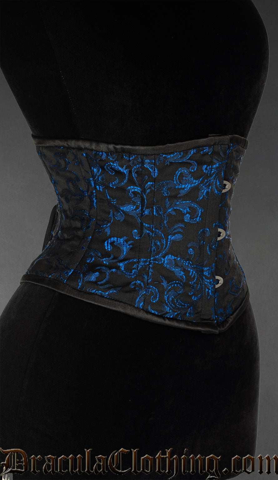 Side view of black waist cincher with woven sapphire blue details on cotton brocade fabric