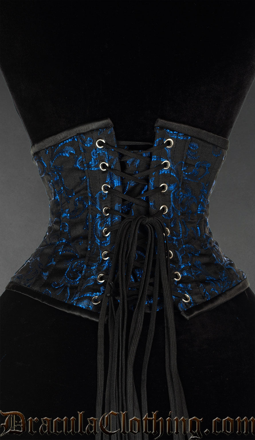 Back view of black and sapphire blue waist cincher showing adjustable corset lacing and matching modesty panel