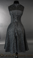 Back of black brocade short bat dress showing adjustable corset style lacing in the back