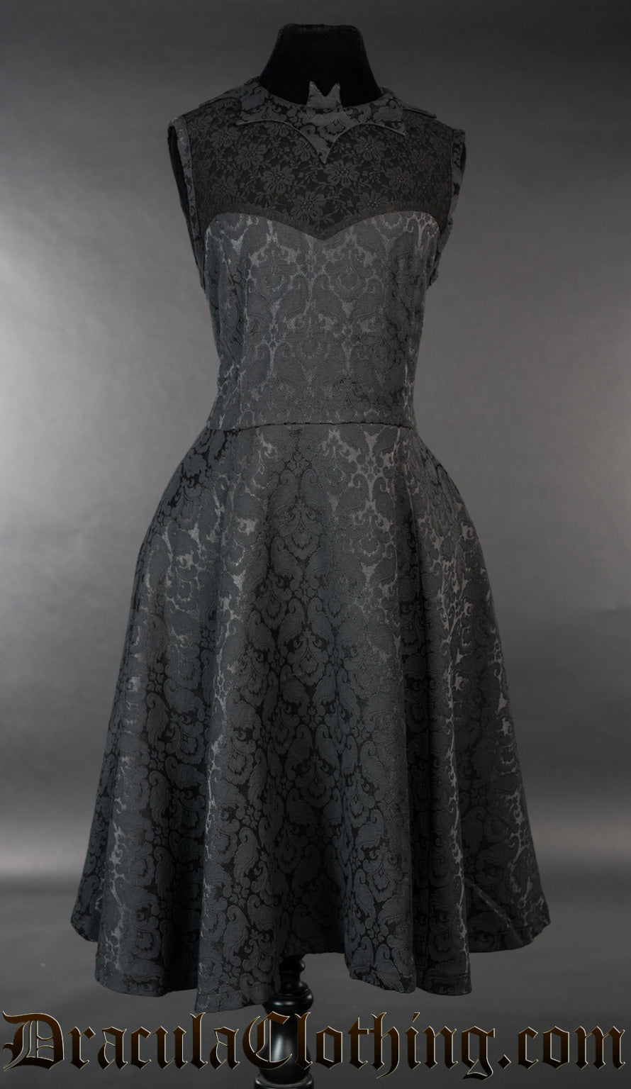 Black brocade women's dress with bat collar