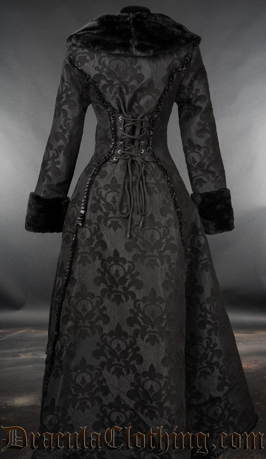 Back view of women's black skull brocade coat with faux fur accents showing adjustable corset style lacing in the torso
