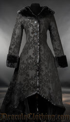 Women's long high low coat with black on black skull brocade design and faux fur collar and cuffs