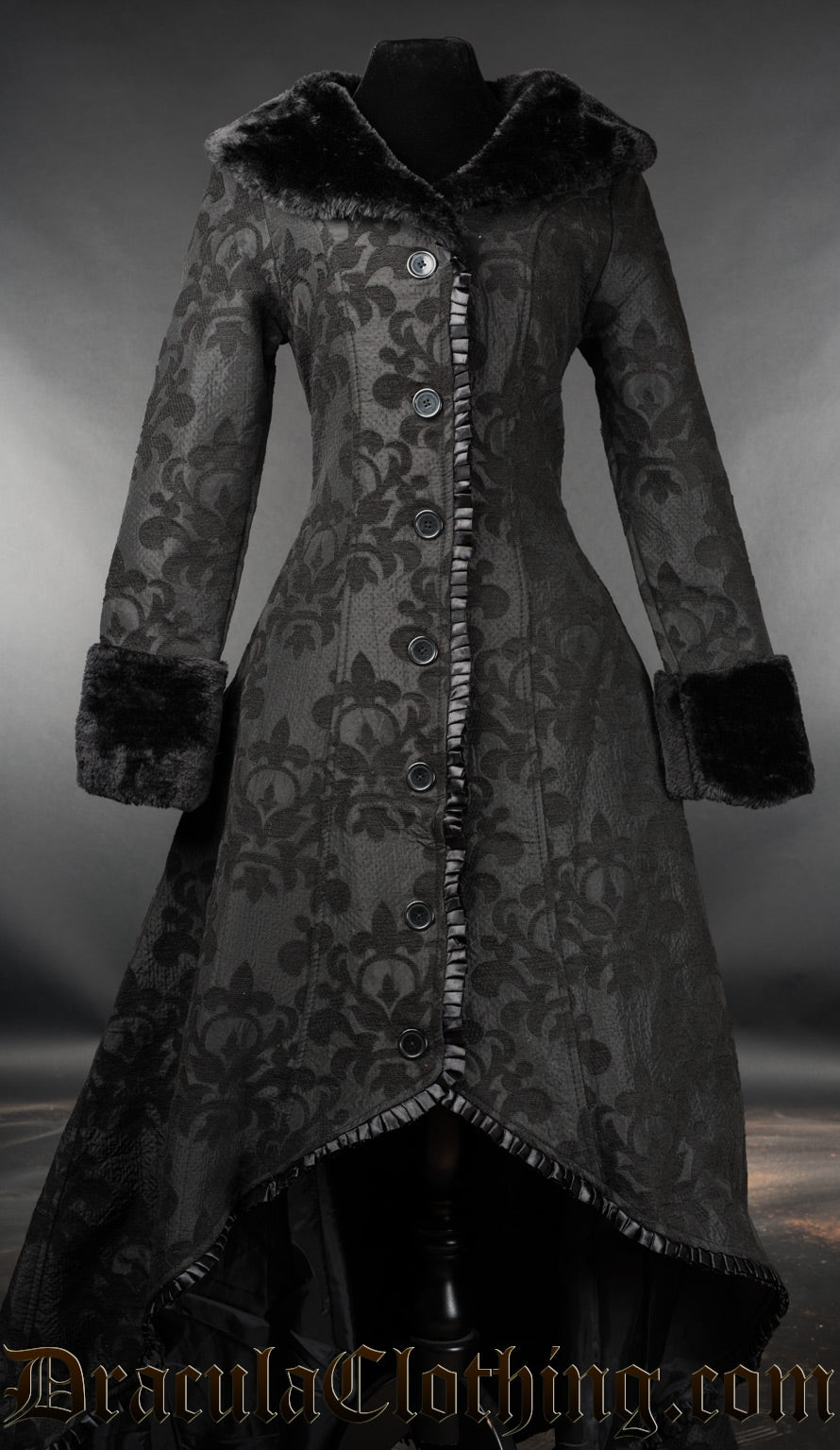 Women's long high low coat with black on black skull brocade design and faux fur collar and cuffs